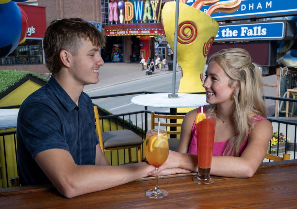 Couple enjoying drinks on Ruby Tuesday's outdoor patio located on Clifton Hill
