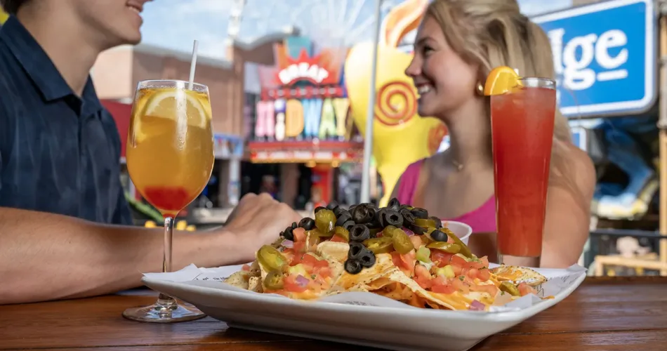 Couple sitting on the outdoor patio of Ruby Tuesdays on Clifton Hill