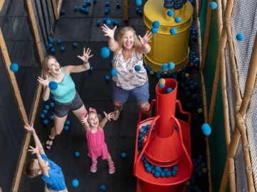A family at Brontoland a Clifton Hill attraction.