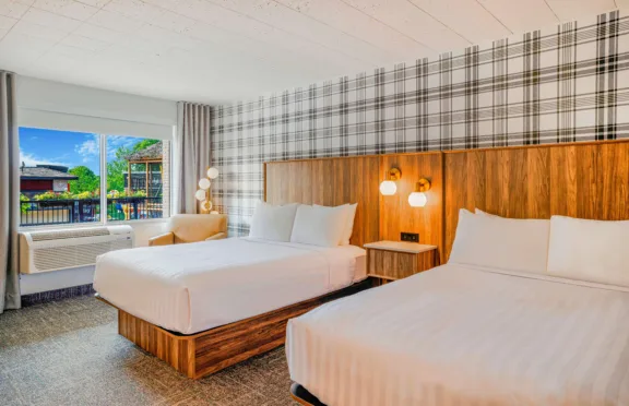 Guest room at Travelodge Niagara Falls with two queen beds.